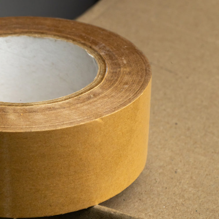 Close-up of a single brown biodegradable adhesive tape roll.			