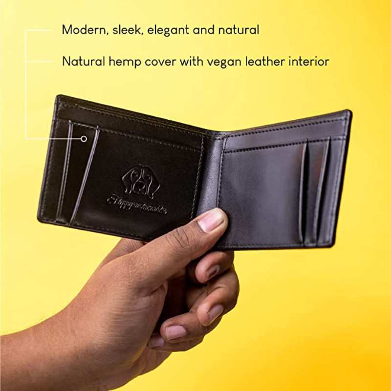 a hand holding a black wallet with natural hemp cover and vegan leather interior | forest wallet for men | modern | sleek | elegant | sustainable			